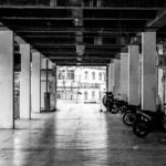 A black and white photo of parking garage